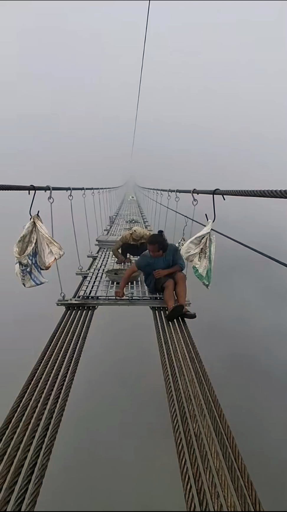 Watch how brave workers conquer thick fog to connect remote Nepal communities