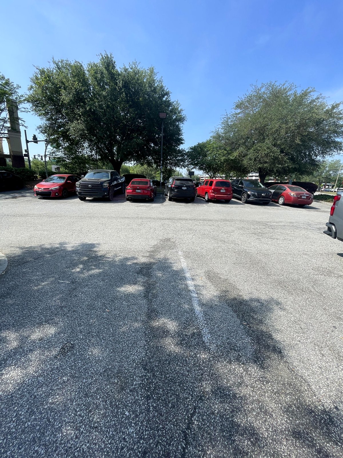 All vehicles in the parking area are switching between red and black.