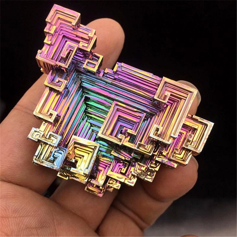 Bismuth crystals develop their unique form naturally as their edges expand more rapidly than their center.