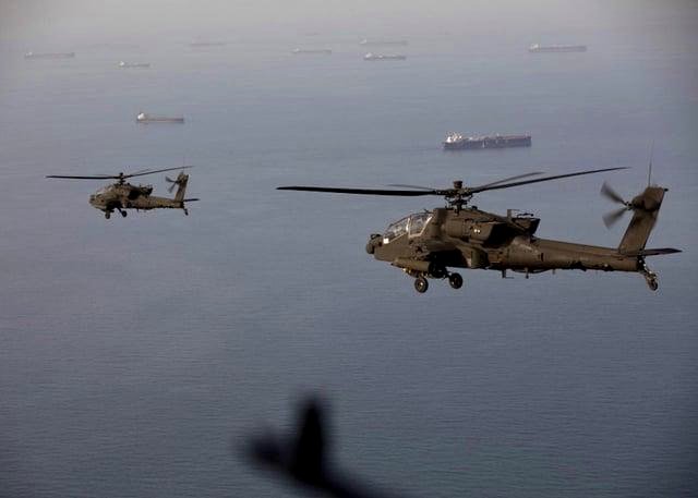 Stunning Photo of Apache Gunships Raises Tension Over Strategic Waters