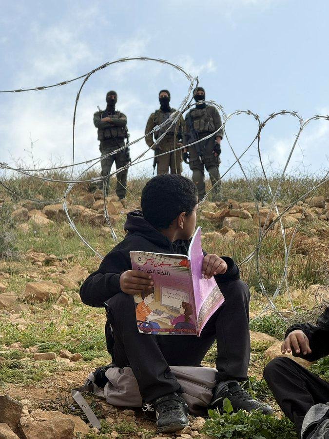A moment frozen in time: Palestinian children face an unseen barrier to school