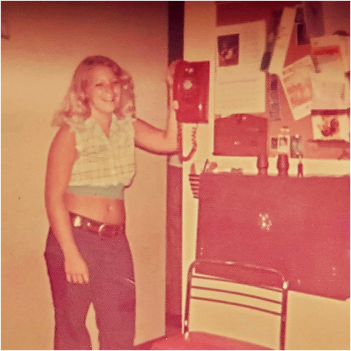 A single rotary phone in the kitchen—who else misses those simpler times?