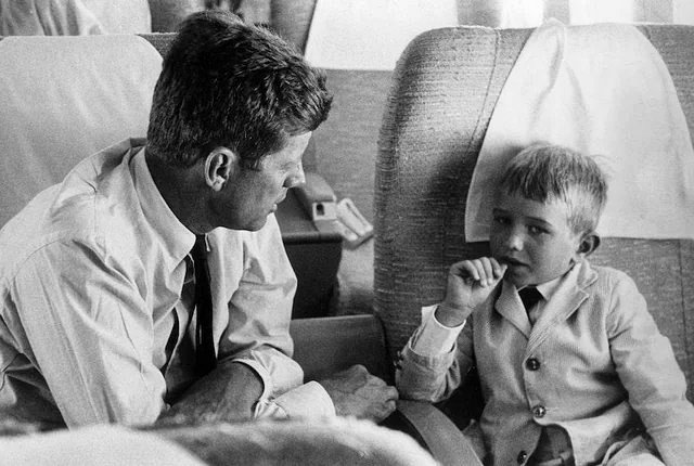 Senator John F. Kennedy hearing his 6-year-old nephew, Robert F. Kennedy Jr., on a campaign flight in 1960.