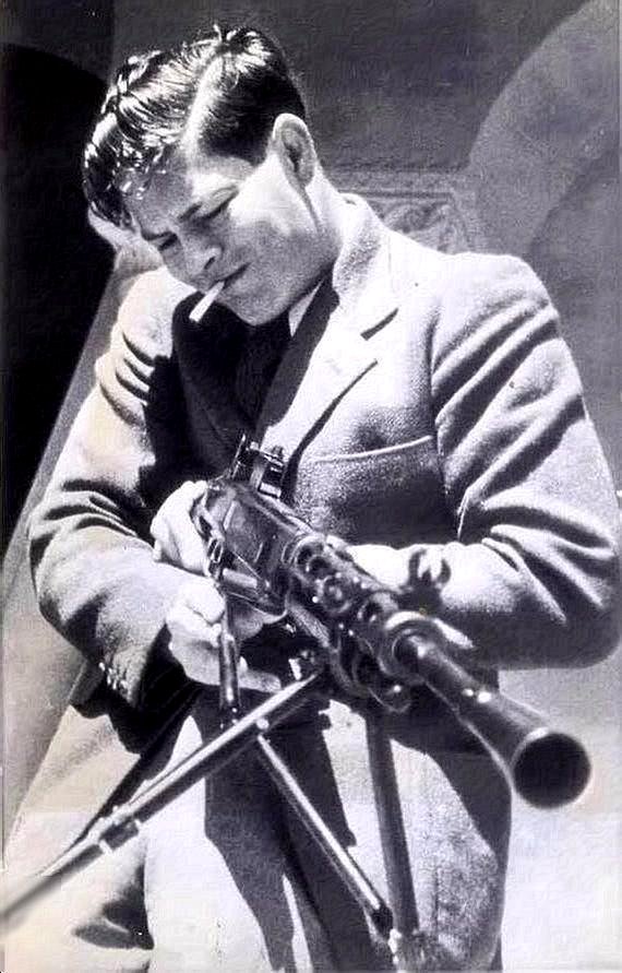 King Michael of Romania smoking a cigarette and handling a Russian firearm in Sevastopol 1942