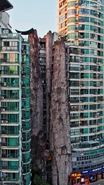 Apartment in Shanghai features Artificial Mountain for feng shui purposes.