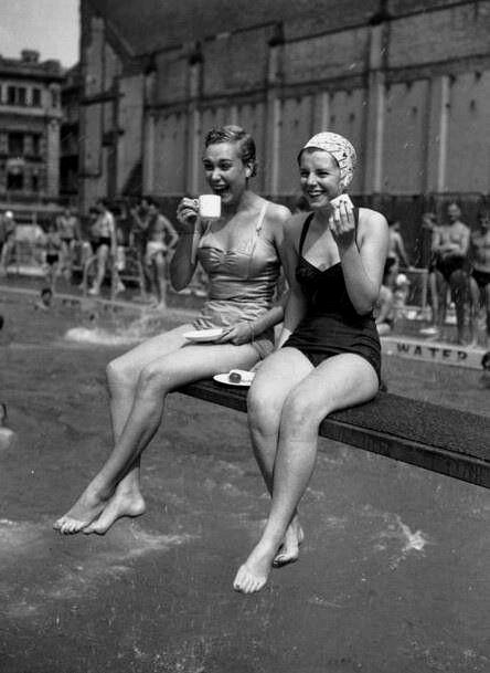 Women enjoying poolside leisure in the 1940s