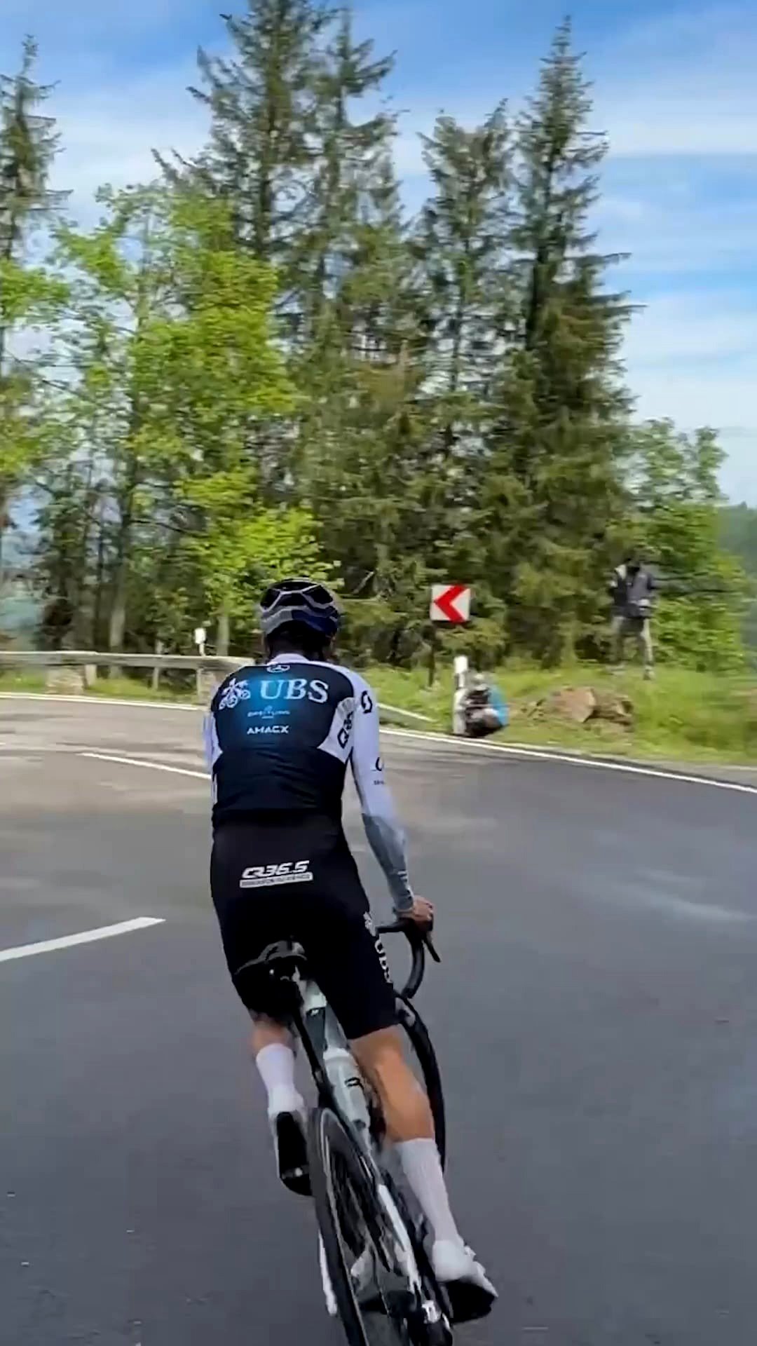 Tom Pidcock sliding on a road bicycle