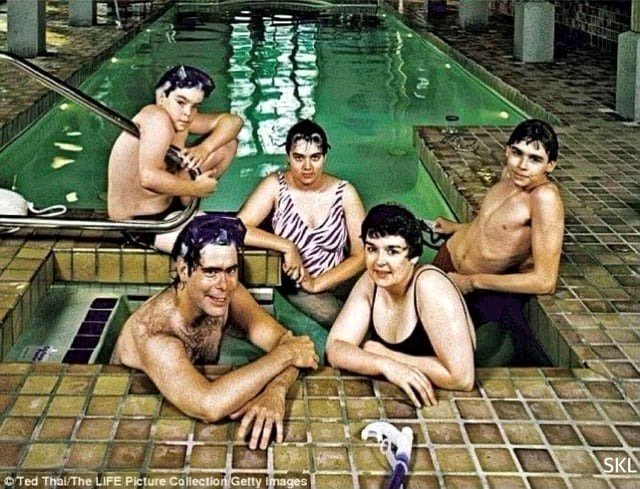 Stephen King and his family assembled by an indoor pool in Bangor, Maine. LIFE magazine, 1986.