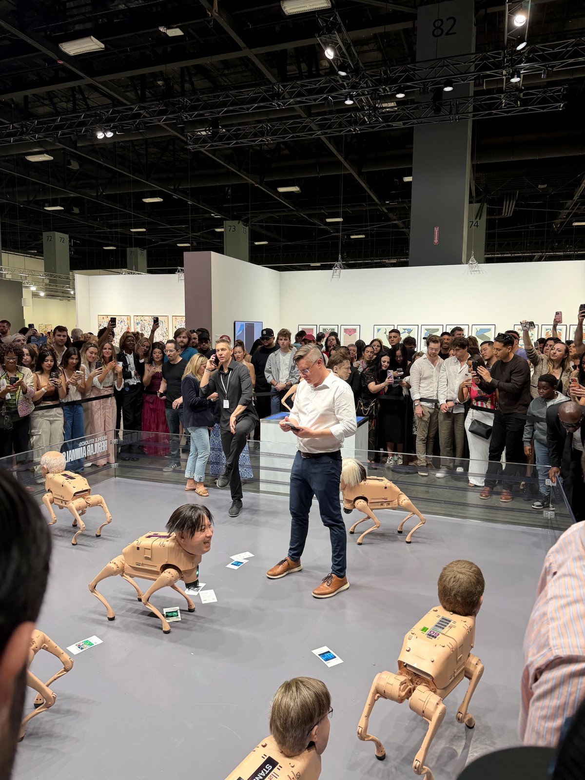Artist Bele's "Regular Animals" showcase at Miami Art Week includes robotic dogs with human heads.