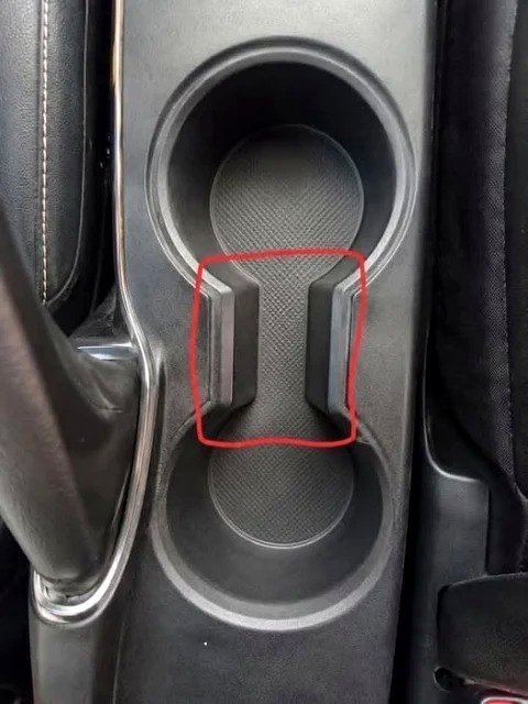 What Is the Strange Space Between Car Cup Holders For? (And Why It’s Truly Ingenious)